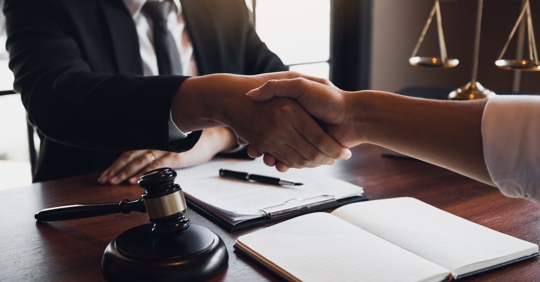 attorney and client shaking hands